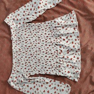 A white top with red flowers